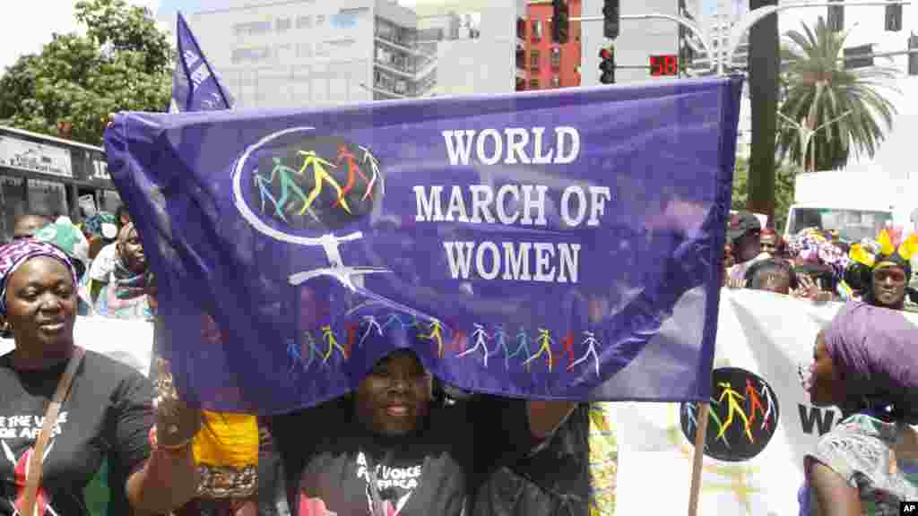 Women from Kenya, Uganda, Tanzania, Rwanda and Burundi participate in the world march of woman in Nairobi, Kenya