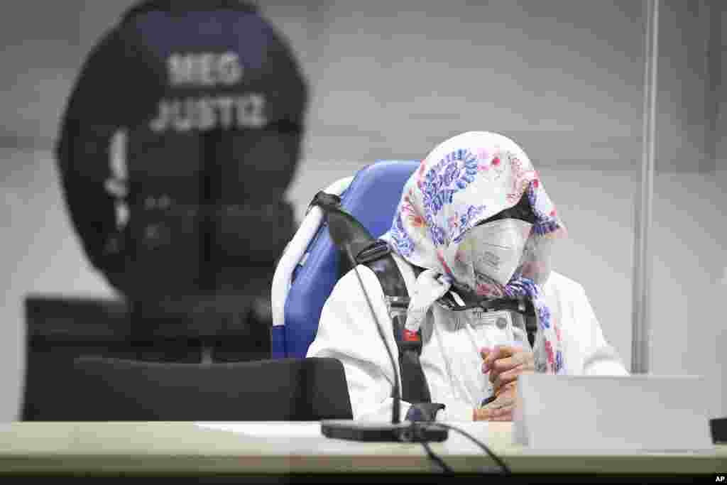 The 96-year-old defendant Irmgard F. sits in an ambulance chair behind a plexiglass screen in a courtroom in Itzehoe, Germany. She is charged of more than 11,000 counts of accessory to murder. Prosecutors argue that she&nbsp; was part of the apparatus that helped the Nazi camp function more than 75 years ago.