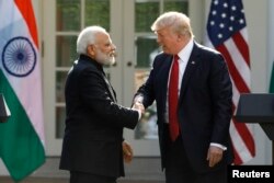 FILE - U.S. President Donald Trump shakes hands with Indian Prime Minister Narendra Modi at a joint news conference in the Rose Garden of the White House in Washington, June 26, 2017.