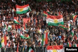 People celebrate to show their support for the upcoming September 25th independence referendum in Zakho, Iraq, Sept. 14, 2017.