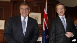 U.S. Secretary of Defense Leon Panetta, left, smiles next to his New Zealand counterpart Jonathan Coleman at the Government House in Auckland, New Zealand, Sept. 21, 2012.