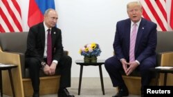 Президент США Дональд Трамп и президент России Владимир Путин. Осака, Япония. 28 июня 2019 г.
