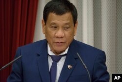 Philippine President Rodrigo Duterte delivers a speech at the start of a banquet hosted by Japanese Prime Minister Shinzo Abe at the latter's official residence in Tokyo, Oct. 30, 2017.