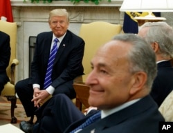 President Donald Trump and Senate Democratic Minority Leader Chuck Schumer are seen during a meeting with other Congressional leaders in the Oval Office of the White House in Washington, Sept. 6, 2017.