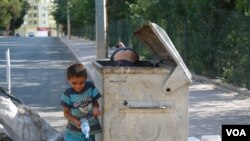 These young Syrian refugees couldn't talk long because they were hard at work near the Turkish border with Syria. Collecting and selling trash together from 7 a.m. to 7 p.m., they can make, at most, $3 a day, Kilis, Turkey, Sept. 6, 2015. (Photo by H. Mu