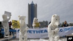 Greenpeace activists dressed as polar bears protest outside Gazprom's headquarters in Moscow, September 5, 2012. 