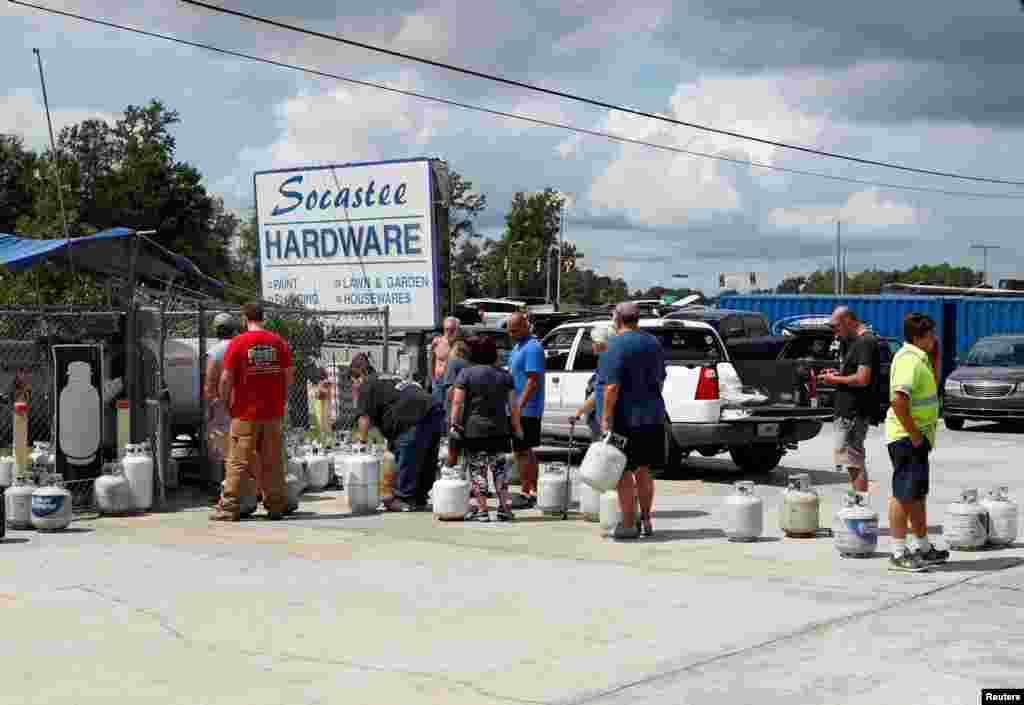 Customers line up to buy propane at Socastee Hardware store, ahead of the arrival of Hurricane Florence in Myrtle Beach, South Carolina, Sept. 10, 2018.