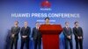 Huawei Rotating Chairman Guo Ping, center, speaks in front of other executives during a press conference in Shenzhen, China's Guangdong province, March 7, 2019. 