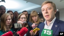 Lithuania's Peasant and Green's Union (LPGU) leader Ramunas Karbauskis speaks to the media after his party prevailed in the second round of voting in the country's parliamentary elections, in Vilnius, Lithuania, Oct. 23, 2016.