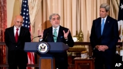 Chief Executive of Afghanistan Abdullah Abdullah, speaks while State Secretary John Kerry, right and Afghan President Ashraf Ghani, left, listen, during a dinner reception at the Department of State, in Washington, Tuesday, March 24, 2015.