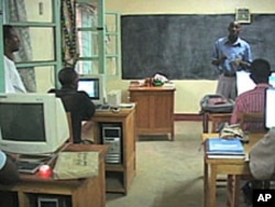 Daniel Macharia, a tutor from Kenya, teaches a class at the Kakuma Distance Learning Center in northern Kenya, Aug 2010