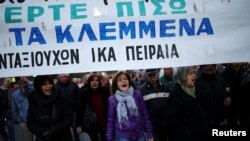 Greek protesters march against government policies affecting pensioners in Athens, Greece, Dec. 15, 2016. The banner reads "Bring back what you have stolen."