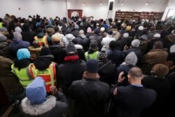 People gather for funeral prayers for the victims of the Twin Parks North West multi-level apartment building fire, at the Islamic Cultural Center in the Bronx borough of New York City, Jan. 16, 2022.