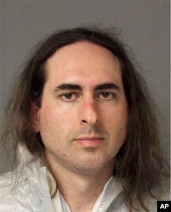 In this June 28 2018 photo released by the Anne Arundel Police, Jarrod Warren Ramos poses for a photo, in Annapolis, Maryland. First-degree murder charges were filed Friday against Ramos who police said targeted Maryland's capital newspaper, shooting his