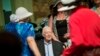 Former president Jimmy Carter, sits to pose for photos after teaching Sunday School class at Maranatha Baptist Church in his hometown Aug. 23, 2015, in Plains, Georgia.