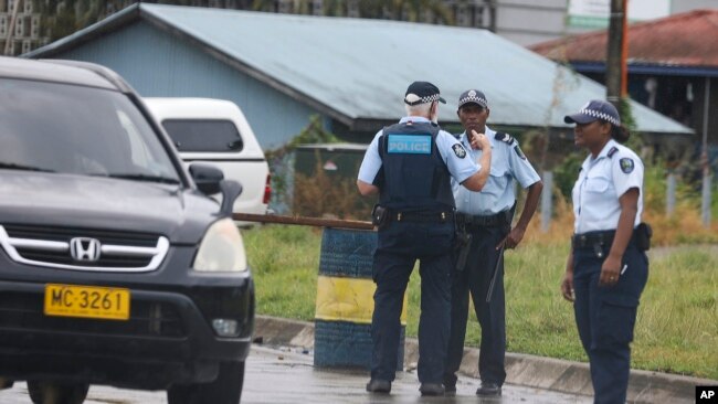 Solomon Islands police and Australian Federal Police man road blocks in Honiara, Solomon Islands, Dec. 6, 2021.