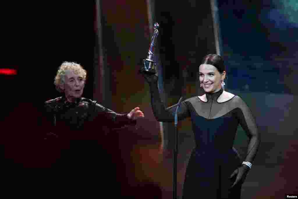 Claire Denis presents the European Achievement in World Cinema award to Juliette Binoche during the 32nd European Film Awards in Berlin, Germany, Dec. 7, 2019.