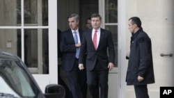 U.S Ambassador to France Charles Rivkin (center) leaves the Foreign Ministry in Paris, after being summoned on Oct. 21, 2013, to explain why America spied on one of its closest allies. 