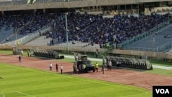 In this photo shared on social media, an Iranian military vehicle is deployed at Tehran’s Azadi Stadium on Aug. 10, 2018, in an apparent effort to quiet football fans chanting “Death to the dictator” ahead of a match.