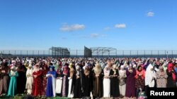 Muslim women pray at Bensonhurst Park to celebrate Eid Al-Fitr, the end of the Ramadan, in the Brooklyn borough of New York City, New York, U.S.,