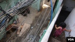 The cables just outside Ahmad’s home, close to where he died in 2015. (J. Owens/VOA)