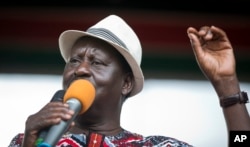 Kenyan opposition leader Raila Odinga addresses his supporters during a rally in the Uhuru Park in Nairobi, Kenya, Oct. 25, 2017.