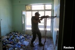 A member of the Iraqi federal police takes his position in the Bab al Jadid district in Mosul, Iraq, June 1, 2017.