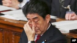 Japanese Prime Minister Shinzo Abe after delivering a speech calling for dialogue between Japan and China and South Korea, at the lower house of Parliament in Tokyo, Jan. 24, 2014.