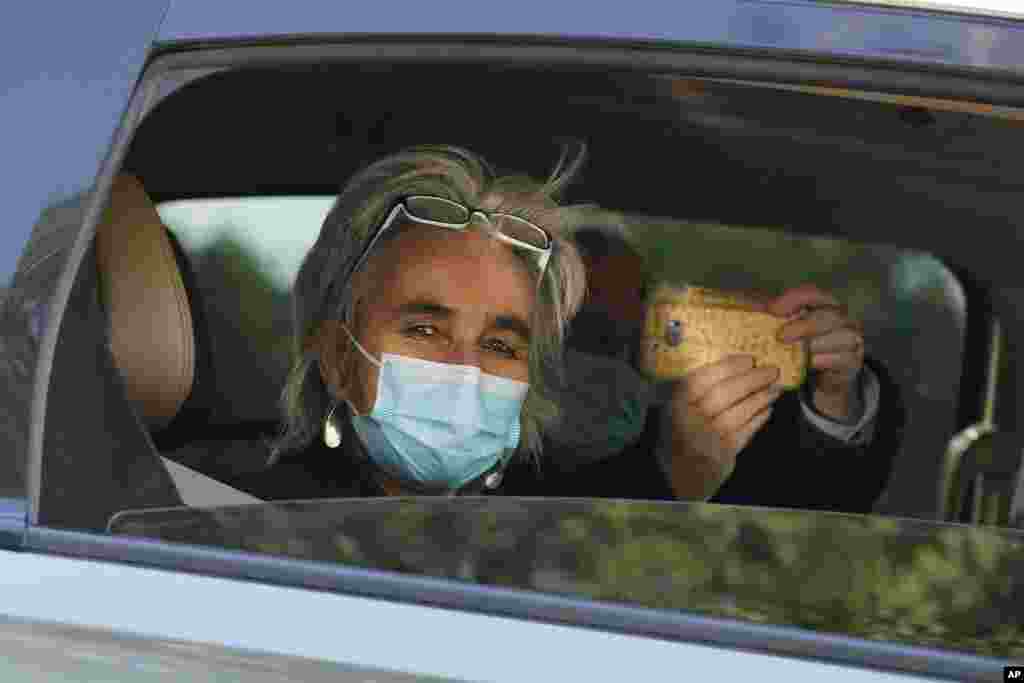 Marion Koopmans, who is part of the World Health Organization team of researchers, looks out from a car during a field trip in Wuhan in central China&#39;s Hubei province.