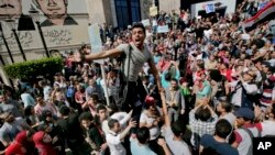 FILE - Egyptians shout slogans against Egyptian President Abdel-Fattah el-Sissi during a protest against the decision to hand over control of two strategic Red Sea islands to Saudi Arabia, in Cairo, Egypt, April 15, 2016.