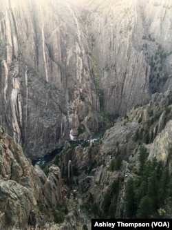 The Gunnison River is seen flowing through Black Canyon