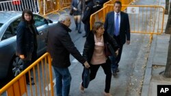 Ex-speaker of the Catalonia parliament Carme Forcadell , front right, arrives at the Spain's Supreme Court in Madrid, Nov. 9, 2017. 