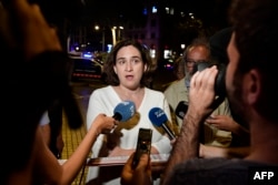 Barcelona's Mayor Ada Colau speaks to the press on the Rambla boulevard after a van ploughed into the crowd, killing at least 13 people and injuring around 100 others on the Rambla in Barcelona, Aug. 17, 2017.