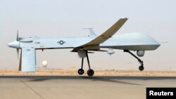 FILE - An MQ-1B Predator from the 46th Expeditionary Reconnaissance Squadron takes off from Balad Air Base in Iraq.