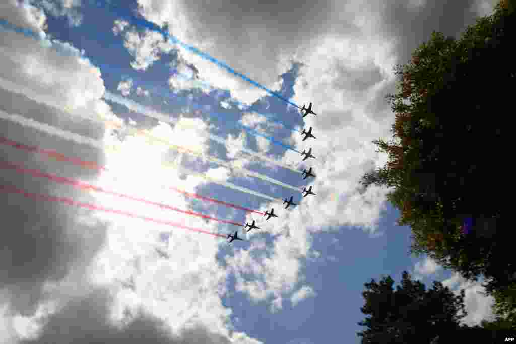 French elite acrobatic flying team &#39;Patrouille de France&#39; (PAF) perform over the Normandy American Cemetery in Colleville-sur-Mer in Normandy, northwestern France, at the end of a French-US ceremony as part of D-Day commemorations marking the 75th anniversary of the World War II Allied landings in Normandy.