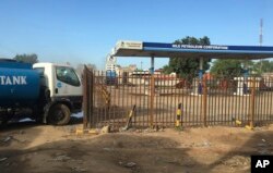 FILE - A truck waits outside a petrol station of the Nile Petroleum Corporation in Juba, South Sudan, Oct. 1, 2017.