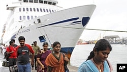Indian passengers disembark the Scotia Prince passenger ferry, as it arrives from the Tuticorin port of India, to Colombo port, June 14, 2011