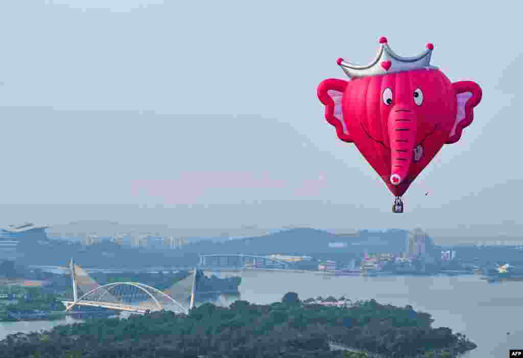 An aerial photo shows a hot air balloon flying over Putrajaya during the international hot air balloon festival in Malaysia.