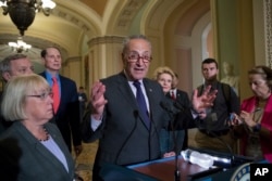 Senate Minority Leader Chuck Schumer, D-N.Y., joined from left by, Sen. Patty Murray, D-Wash., Sen. Dick Durbin, D-Ill., Sen. Ron Wyden, D-Ore., and Sen. Debbie Stabenow, D-Mich., speaks with reporters about the Obama health care law on Capitol Hill in Washington, July 25, 2017.