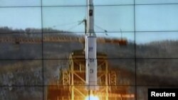 A screen shows the Unha-3 [Milky Way 3] rocket being launched from a launch pad at the West Sea Satellite Launch Site, at North Korea's satellite control centre in Cholsan county, North Pyongan province in this picture released by the official KCNA news a