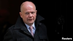 Britain's Foreign Secretary William Hague leaves after attending a Cabinet meeting at Number 10 Downing Street in London, Mar. 12, 2013. 