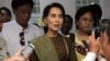 Burma's opposition leader Aung San Suu Kyi talks to journalists during a press briefing in Rangoon, Jan. 2, 2014. 