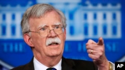FILE - National security adviser John Bolton speaks to reporters during the daily press briefing at the White House.