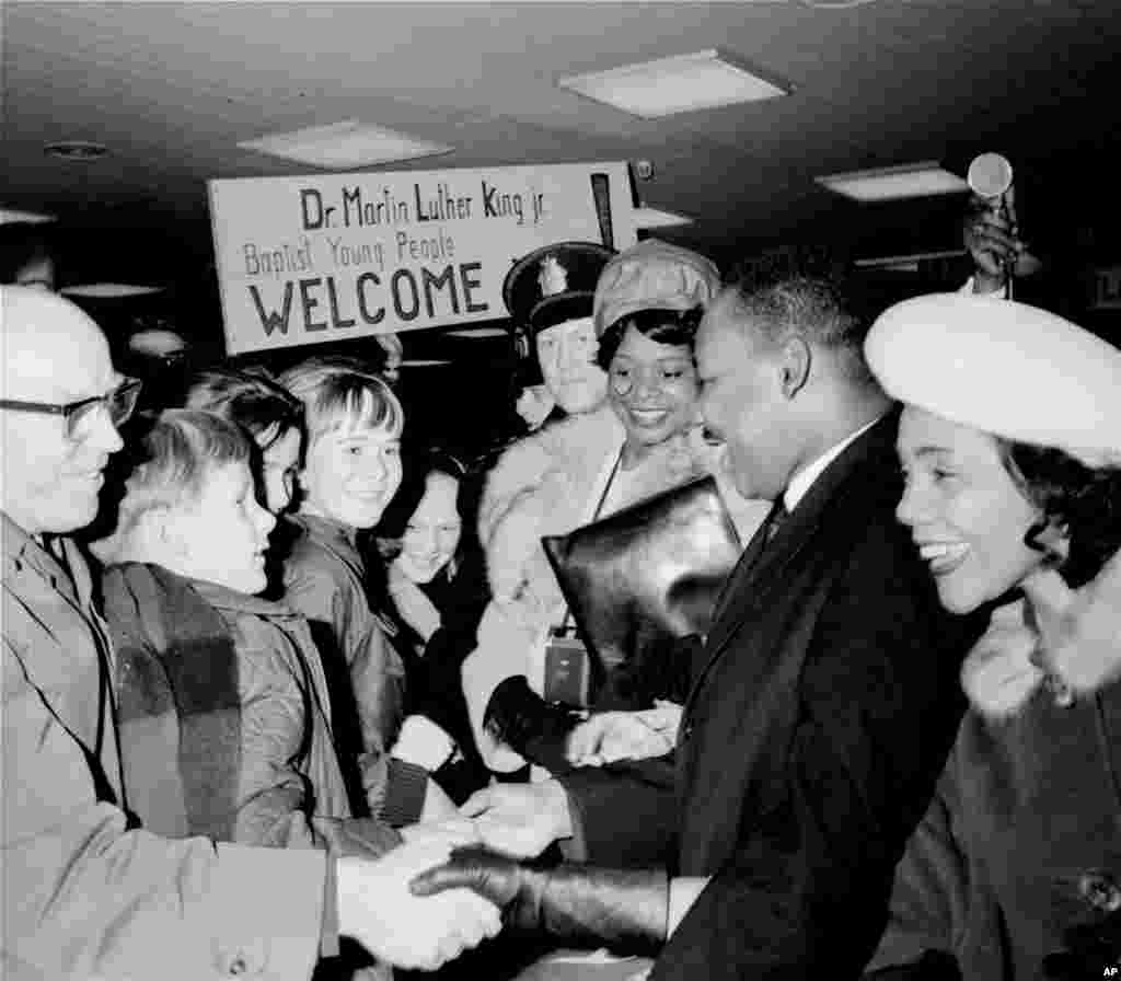 Martin Luther King, Jr. is welcomed by Baptist youths on arrival in Oslo, Norway, to accept the Nobel Peace Prize, Dec. 8, 1964.