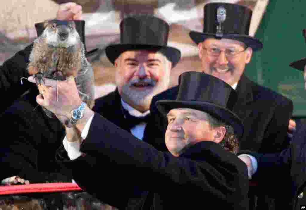 Groundhog Club handler John Griffiths holds Punxsutawney Phil during the 126th celebration of Groundhog Day in Punxsutawney, Pa., Feb. 2, 2012. Tradition has it that if Phil sees his shadow, there will be six more weeks of winter. (AP)