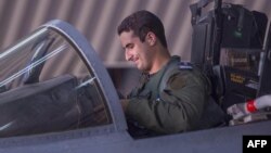 This file handout picture released by the official Saudi Press Agency (SPA), Sept. 24, 2014 shows Saudi Arabian air force pilot Prince Khaled bin Salman sits in the cockpit of a fighter jet at an undisclosed location.
