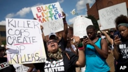 FILE - Protesters rally during a Black Lives Matter demonstration, July 10, 2016, in Cincinnati.