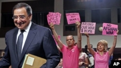 Protestors demonstrate as CIA Director Leon Panetta arrives to testify at his Senate confirmation hearings to become U.S. Secretary of Defense on Capitol Hill, Washington, June 9, 2011