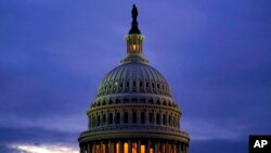 FILE - The light in the cupola of the Capitol Dome is illuminated, in Washington, Oct. 6, 2021. 