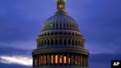 FILE - The light in the cupola of the Capitol Dome is illuminated, in Washington, Oct. 6, 2021. 